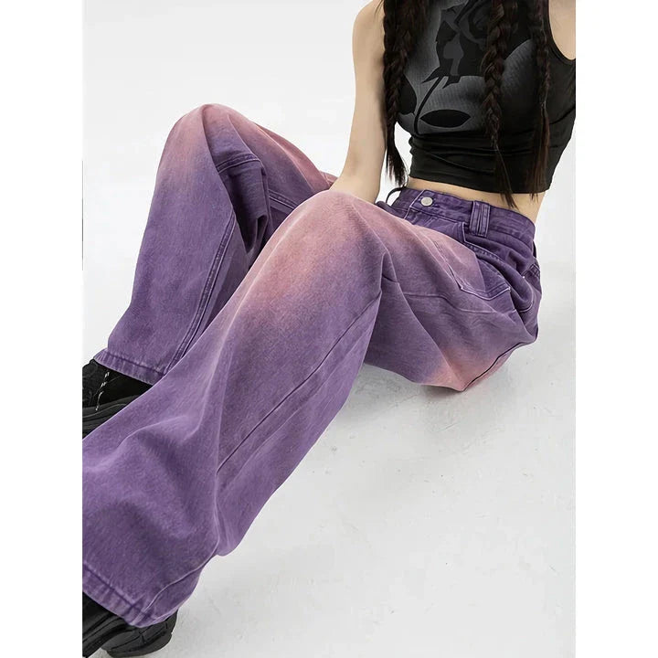 Stylish high-waist purple wide-leg jeans with elegant button details and a premium denim design