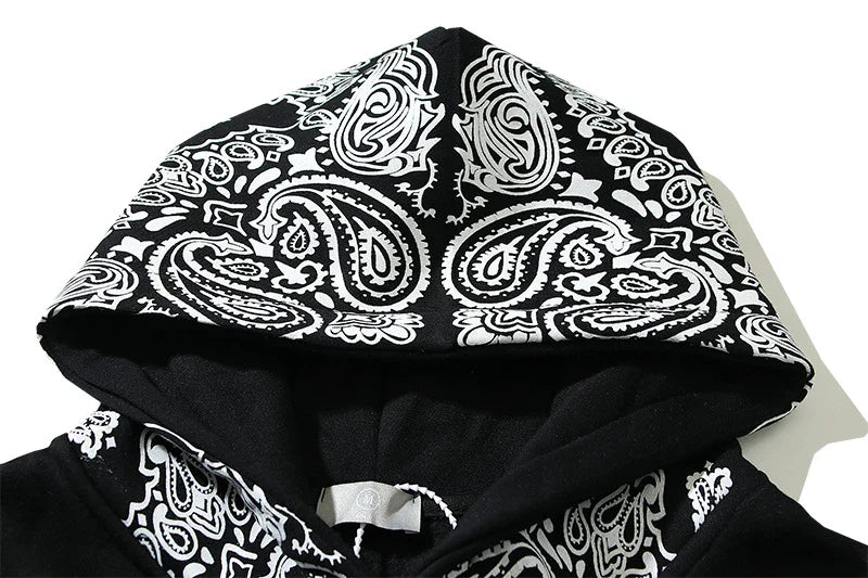 A cosy, fleece-lined hoodie with a classic paisley pattern, a relaxed fit, and practical side pockets for easy style and comfort.