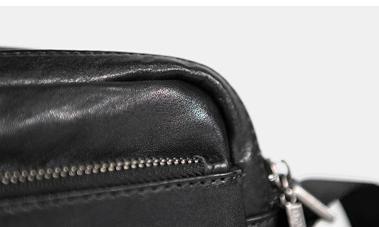 A premium British leather shoulder bag with a sleek, minimalist design and adjustable strap