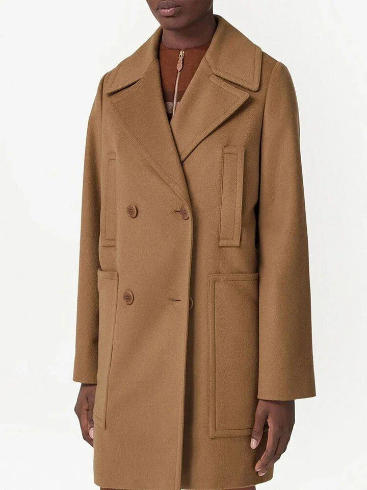 A stylish mid-length double-breasted overcoat made from a warm, durable wool and polyester blend fabric