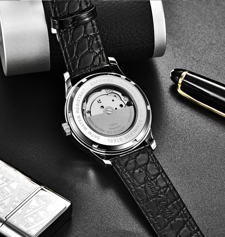 A sophisticated automatic mechanical watch with a gold/white or gold/black face, stainless steel case, and genuine leather strap