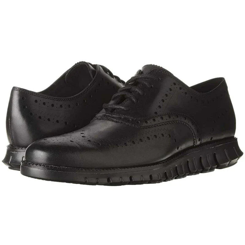A pair of premium leather business shoes with a thick rubber sole and a stylish leather toe cap, available in brown and black colours.