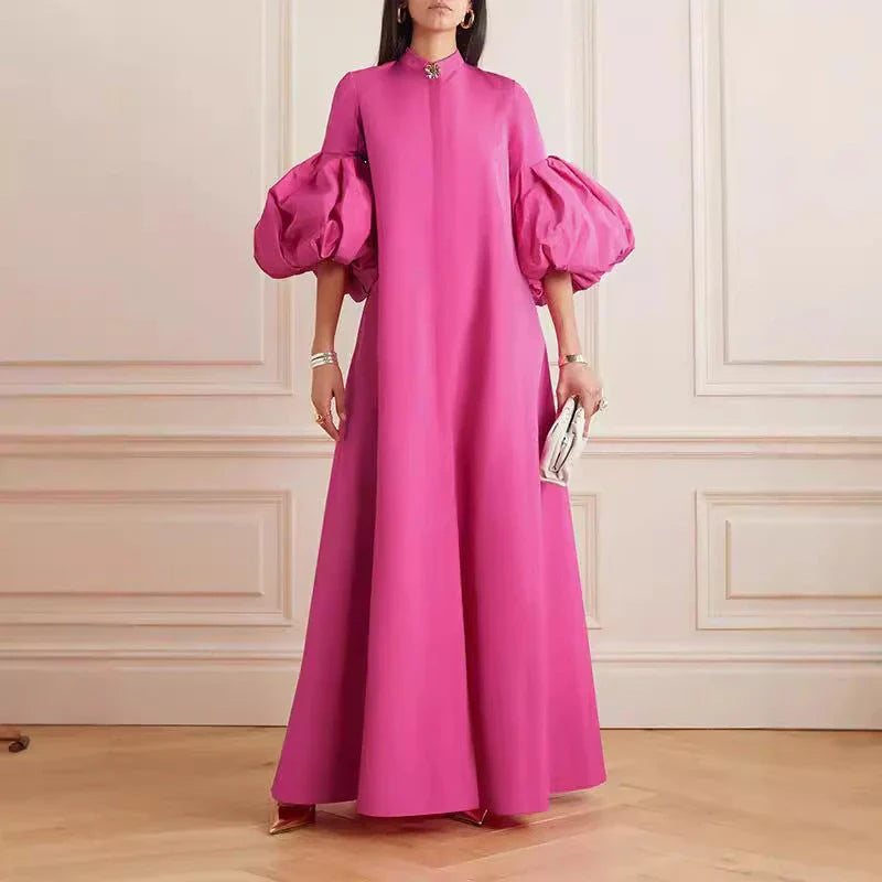Elegant floral evening gown in a range of vibrant colours, featuring a loose, flattering fit and chic lapel design