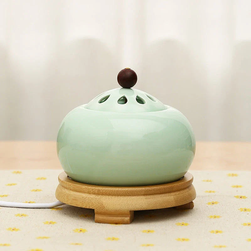 Elegant electric incense burner with adjustable temperature and timer function, perfect for creating a soothing ambiance in your home.