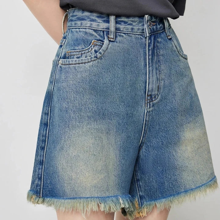Vintage-inspired high-waisted denim shorts with tassel detailing for women