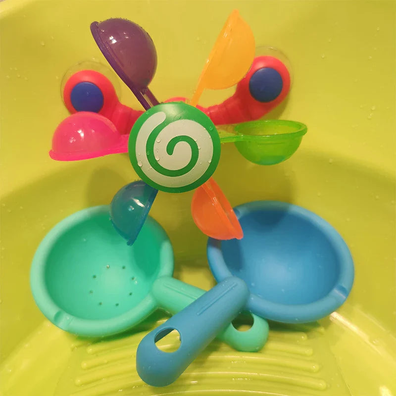 Colourful children's bath toy with a turning windmill and spoon for imaginative water play