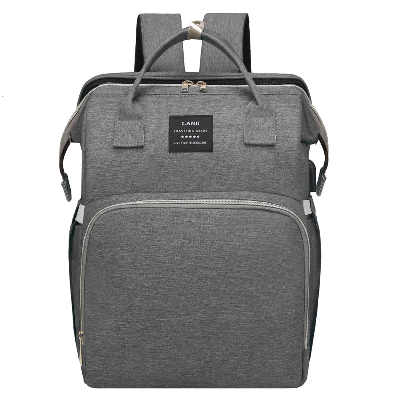 Multifunctional maternity diaper backpack with removable mosquito net, foldable crib, and water-resistant design for convenient family travel
