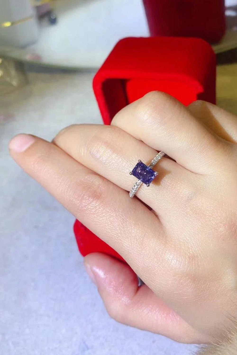 Elegant 1 Carat Moissanite Sterling Silver Ring in a beautiful blue hue, showcasing a minimalist design and premium construction.