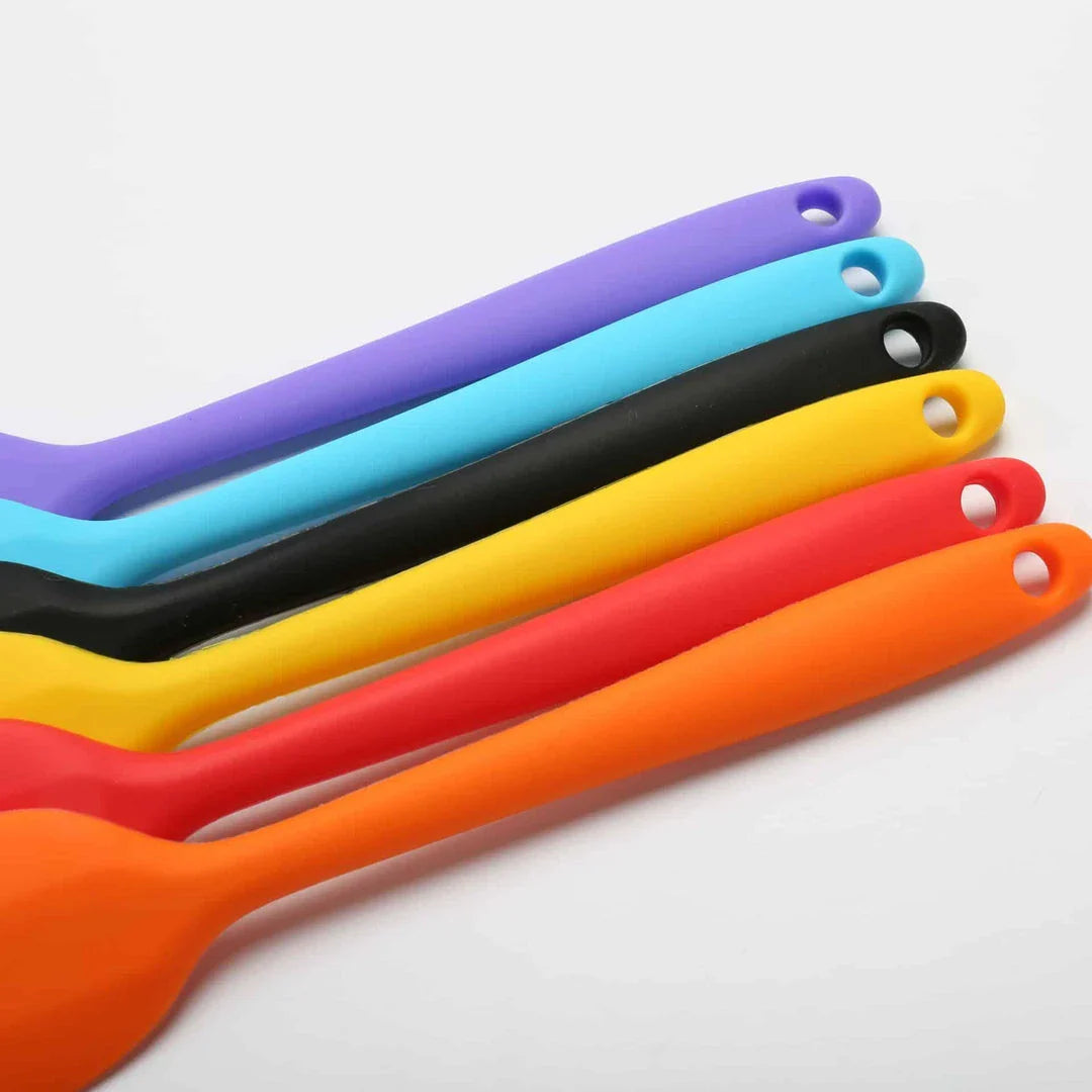 Versatile non-stick silicone cooking spatula in various colours, perfect for flipping, stirring, and serving a wide range of dishes