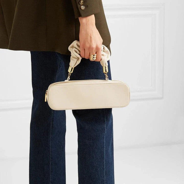 Sophisticated long shoulder diagonal bag with a sleek horizontal square design, made of durable synthetic leather and featuring a single shoulder strap for hands-free convenience.