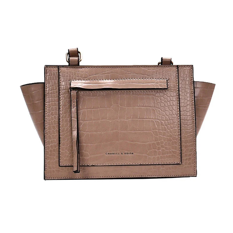 Premium British-designed messenger bag in wine red colour, featuring a spacious and stylish design with a single strap for comfortable carrying.
