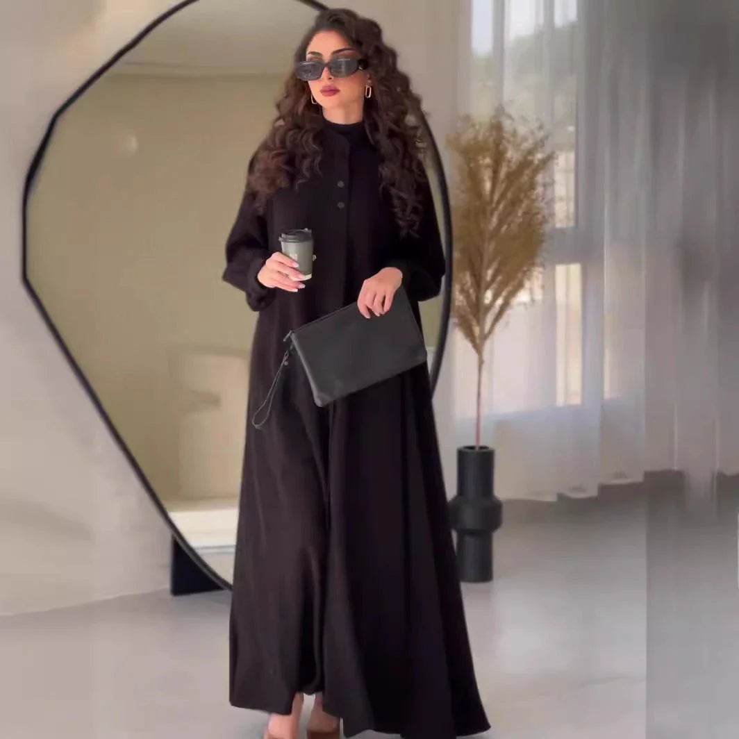 Premium black commuter swing skirt dress with long sleeves and an elegant A-line silhouette