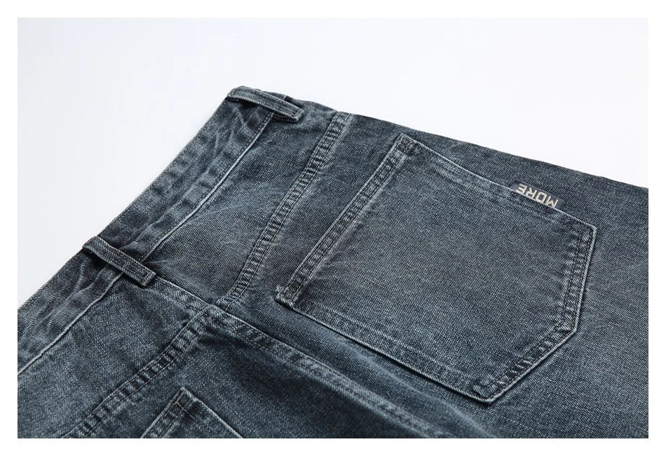 A pair of stylish retro-inspired Japanese jeans in black and grey, featuring a mid-rise waist and straight leg silhouette for a flattering, comfortable fit.