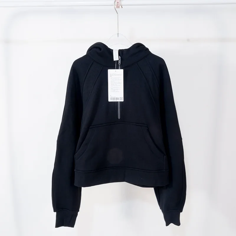 Premium women's sports fleece hoodie with half zip, available in a range of sophisticated colours