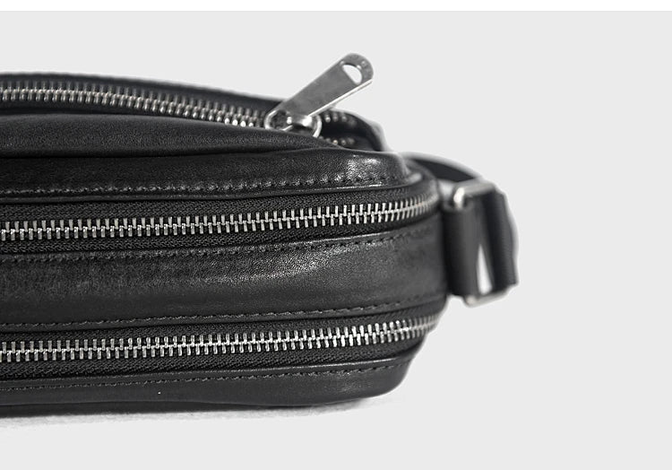 A premium British leather shoulder bag with a sleek, minimalist design and adjustable strap