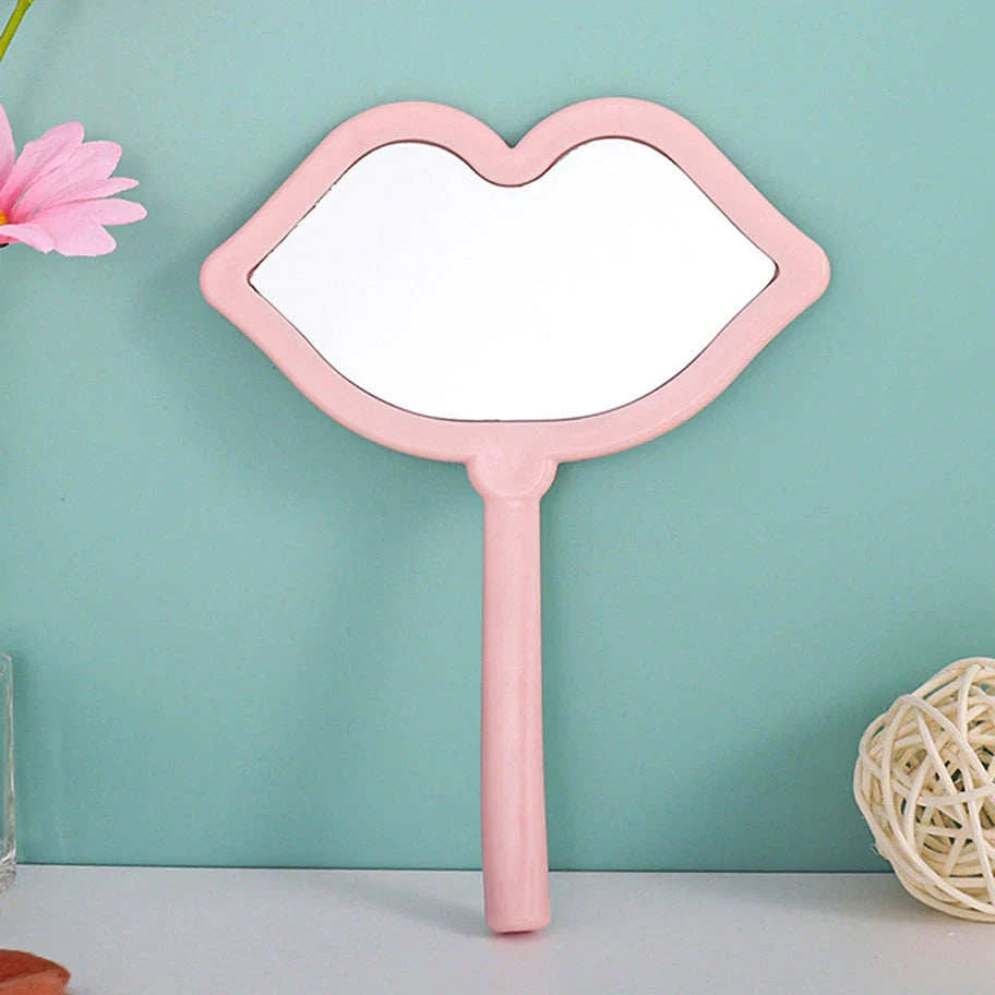 Lip-shaped handheld makeup mirror with a comfortable ergonomic handle for precise on-the-go touch-ups