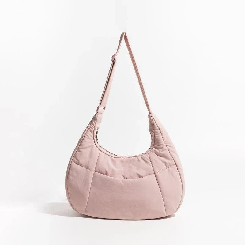 Chic Half Moon Puffer Shoulder Bag in a stylish pink colour, featuring a unique design and practical features for the modern woman.