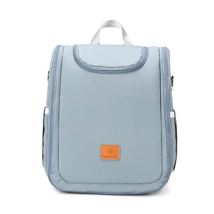 Versatile baby changing backpack with convertible crib bed, large storage capacity, and insulated feeding bottle compartment
