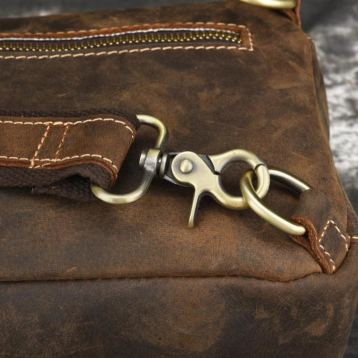 Vintage-inspired genuine leather briefcase with multiple compartments and secure zipper closure, ideal for modern commuters