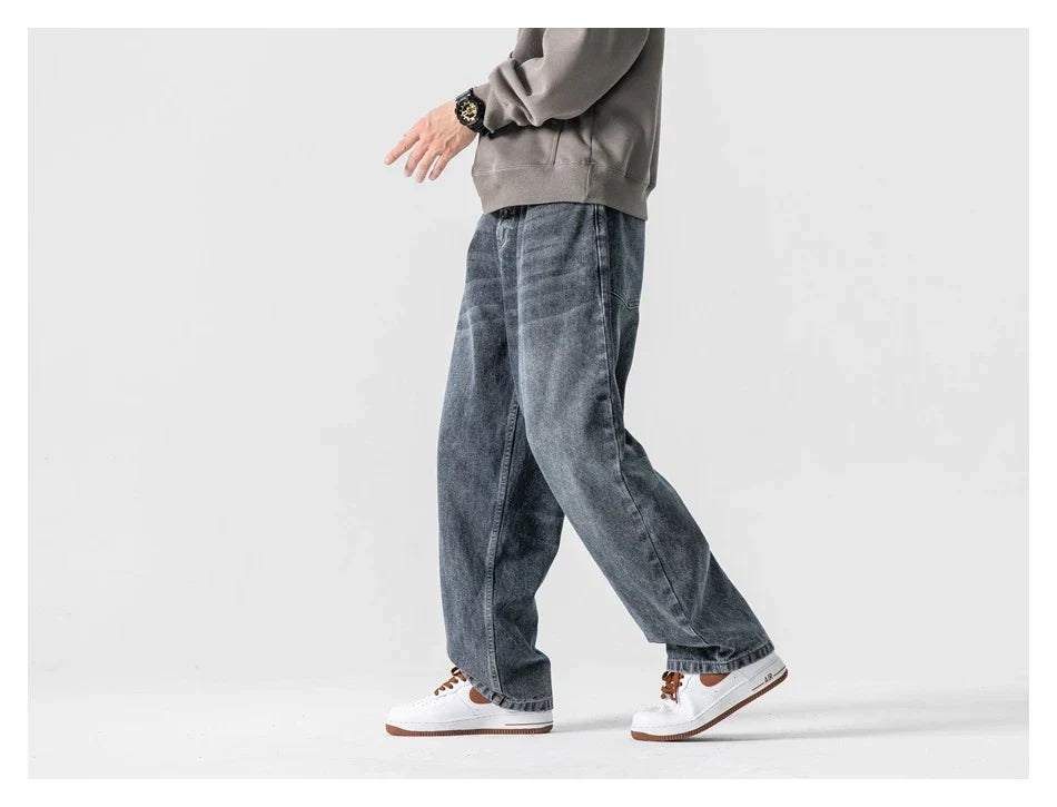 A pair of stylish retro-inspired Japanese jeans in black and grey, featuring a mid-rise waist and straight leg silhouette for a flattering, comfortable fit.