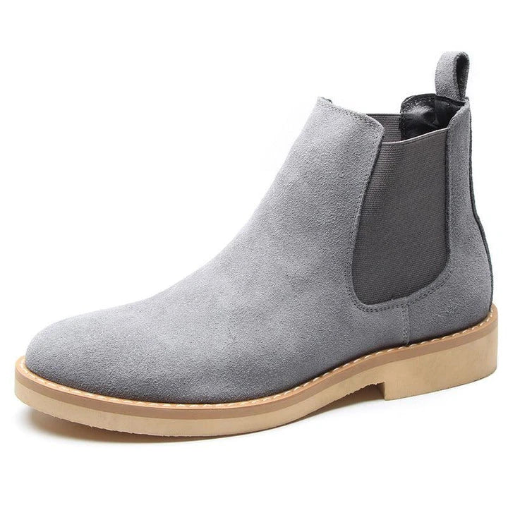 Stylish British-crafted Martin boots with a microfibre upper, pointed toe, and rubber sole for superior comfort and stability.