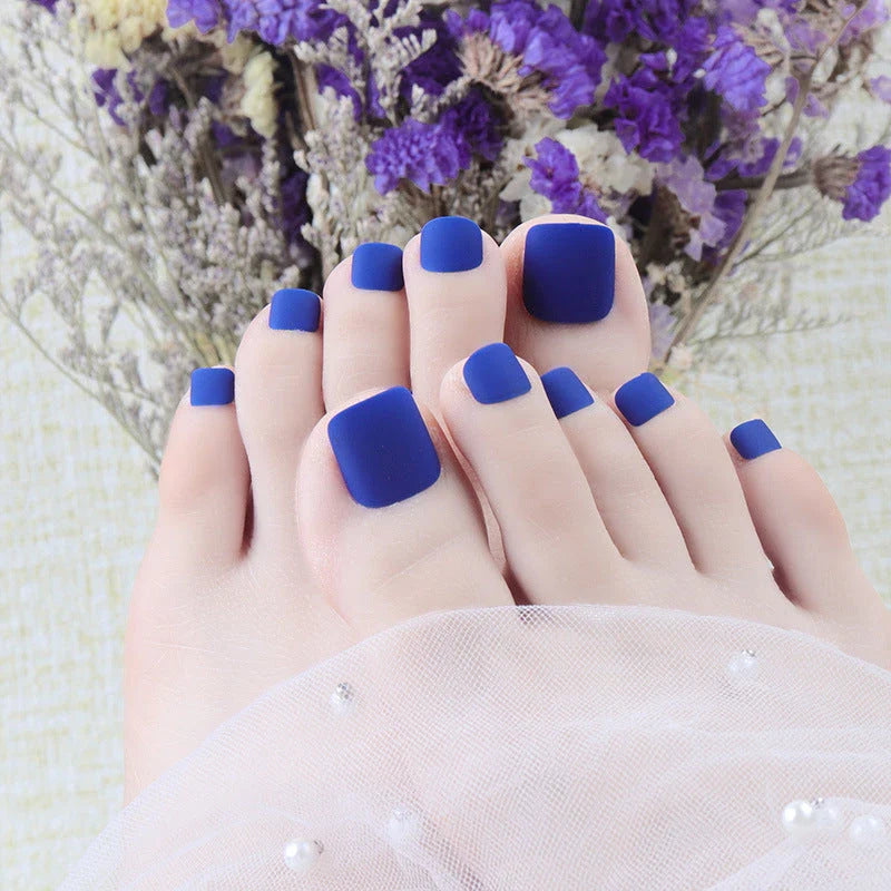 Premium white matte full coverage press-on toenails with secure adhesive for a flawless at-home pedicure