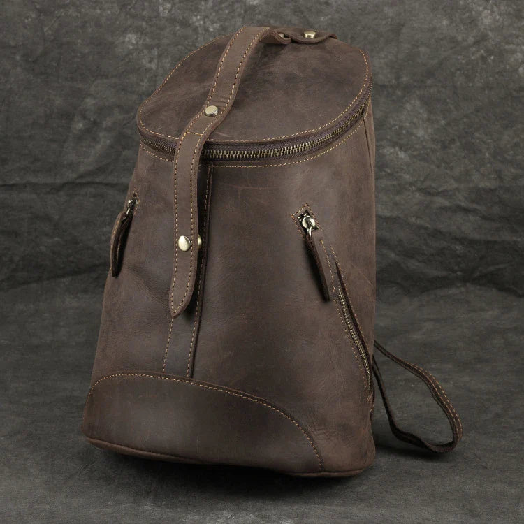 A premium Crazy Horse leather backpack with a classic bucket-style design and retro-inspired flair, perfect for the discerning urban adventurer.