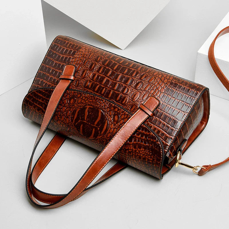 Premium crocodile pattern leather shoulder bag in multiple colours, featuring a pillow-shaped design for comfortable carrying and multiple interior pockets for organisation.
