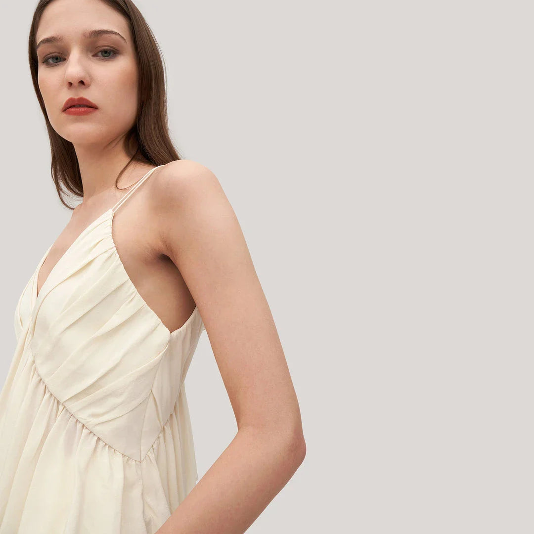 Elegant and refined silk camisole with V-neck design and delicate spaghetti straps, perfect for the modern British fashion enthusiast