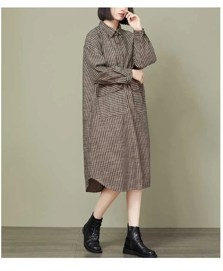 Plus-size women's dress with a striped pattern, asymmetric skirt, and long loose sleeves