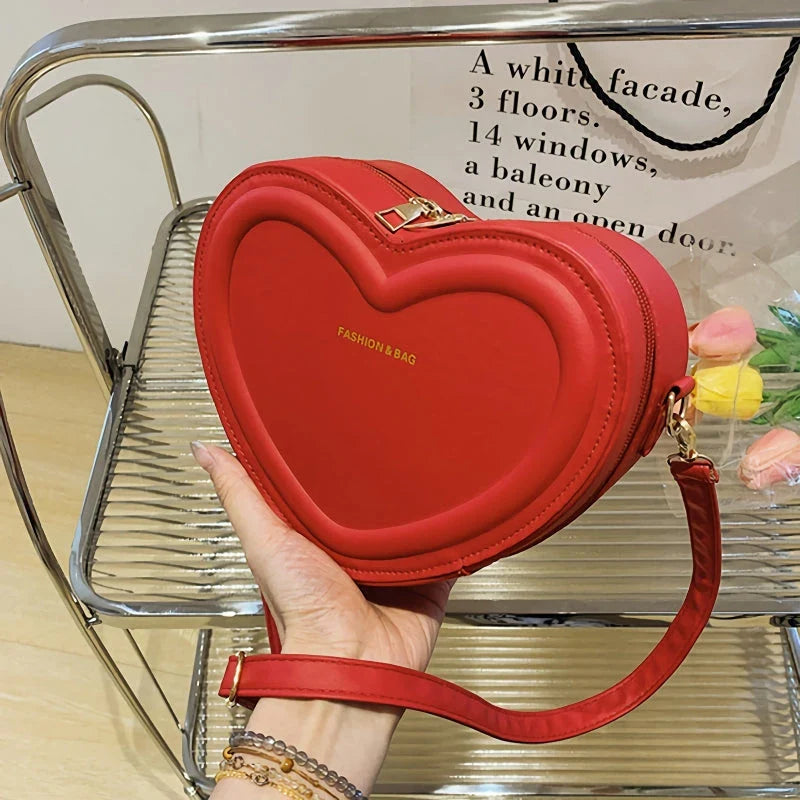 Chic heart-shaped crossbody bag made from premium PU leather, available in multiple stylish colours