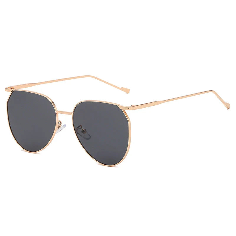 Elegant oval-shaped sunglasses with gradient lenses and alloy frames, offering timeless British style and UV protection.
