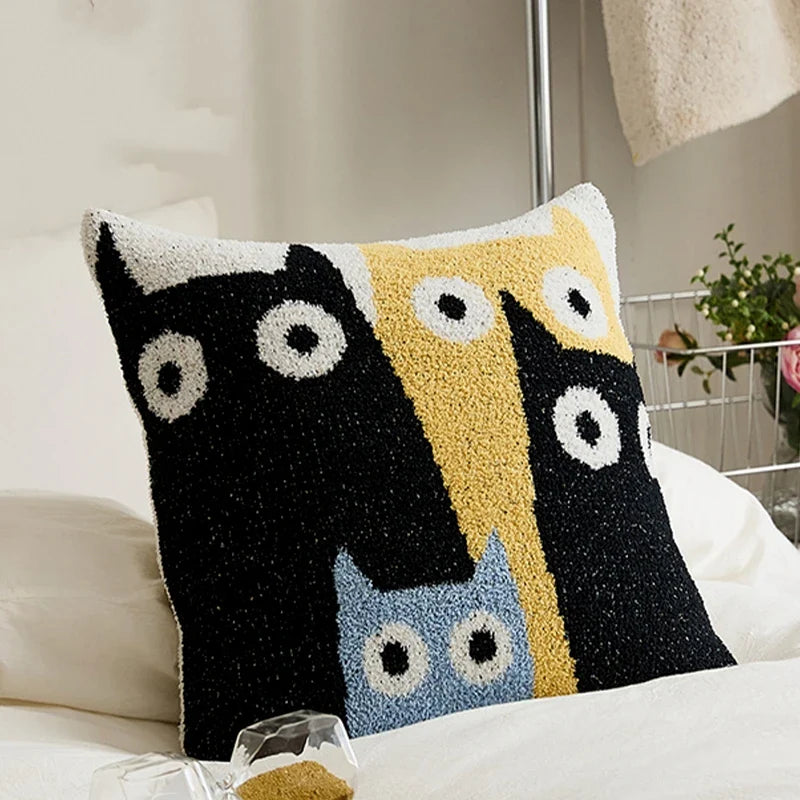 A cosy cushion cover with a charming crescent moon cat design, made from soft plush fabric for a luxurious home decor accent.