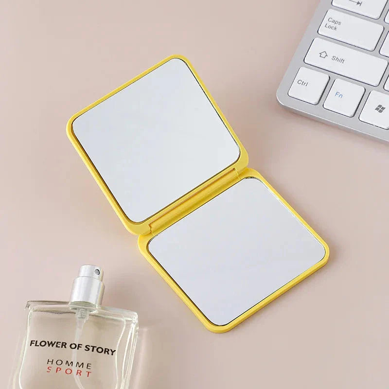 Portable Folding Double-Sided Makeup Mirror in Blue, Pink, Black, and Silver Colours