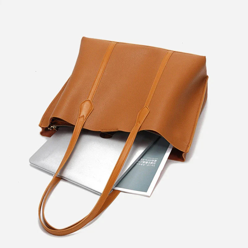Premium cowhide leather shoulder bag with multiple compartments and adjustable strap for versatile everyday use