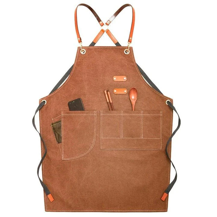 Premium canvas barista apron with British-inspired design, perfect for protecting clothing while crafting coffee.