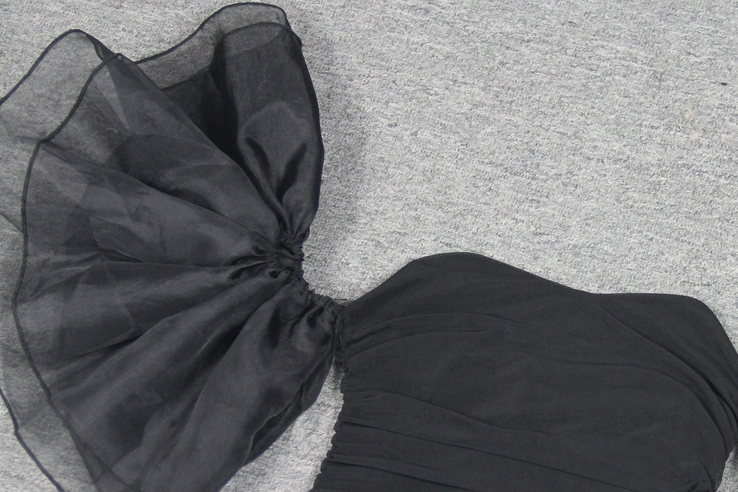 Elegant puff sleeve mesh dress with a flattering short, irregular skirt in white and black colours
