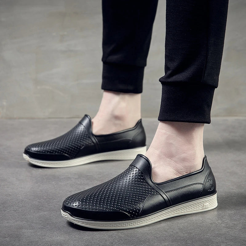 Stylish waterproof rain boots for men, featuring a unique design and durable construction for comfortable wear in wet weather.