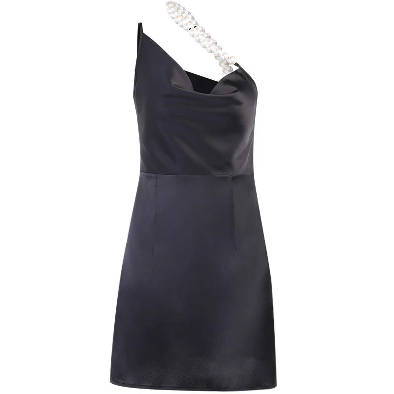 Stylish irregular French halter skirt with pearl-inspired design, showcasing a sophisticated and versatile fashion piece.