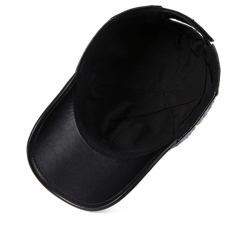 A stylish men's baseball cap made from warm, first-layer cowhide leather with an eye-catching ostrich pattern design.