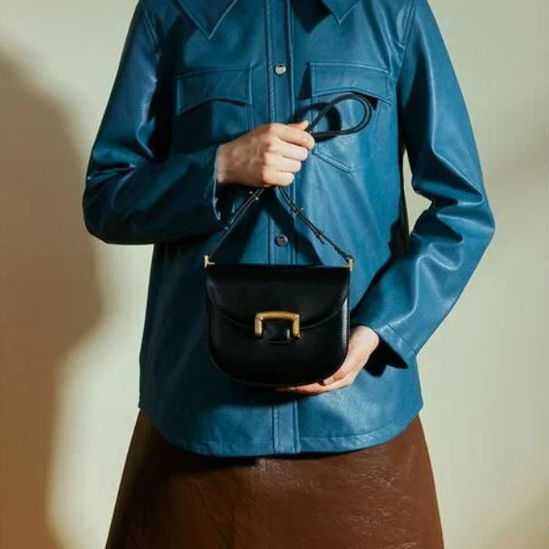 Premium high-end British wedding shoulder bag in brown, with a unique saddle shape design and hardwearing leather exterior