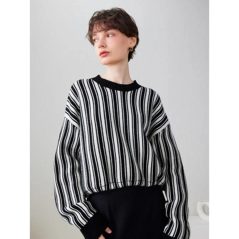A chic striped wool-blend jumper in black, featuring an elegant O-neck design and a relaxed, flattering fit