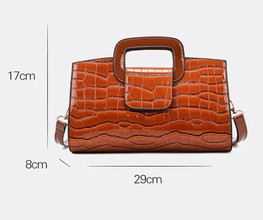 A stylish and versatile retro-patterned handbag with a sturdy canvas construction and organised interior, perfect for everyday use in the UK.