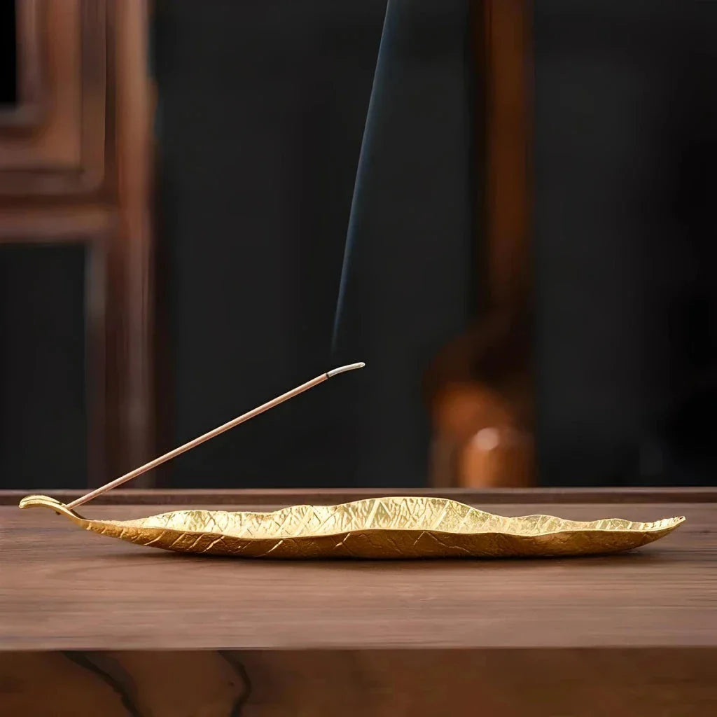 Elegantly crafted copper alloy incense holder with Bodhi leaf design, perfect for meditation and home decor