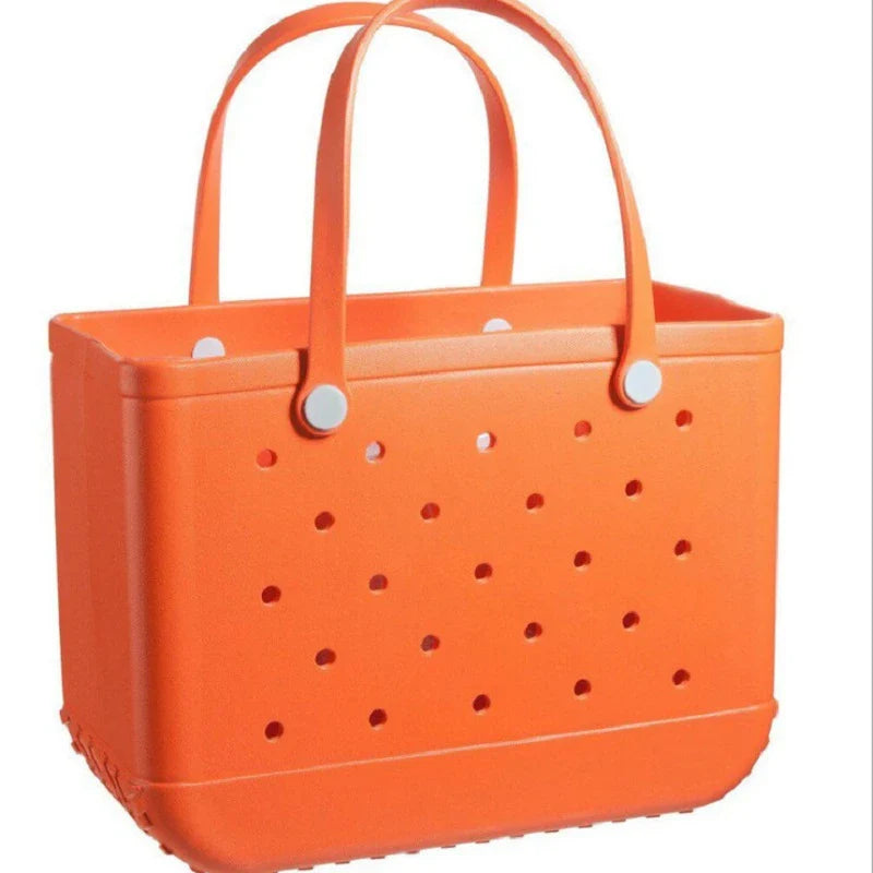 Premium waterproof beach tote bag in various vibrant colours, featuring spacious main compartment and multiple pockets for organised storage