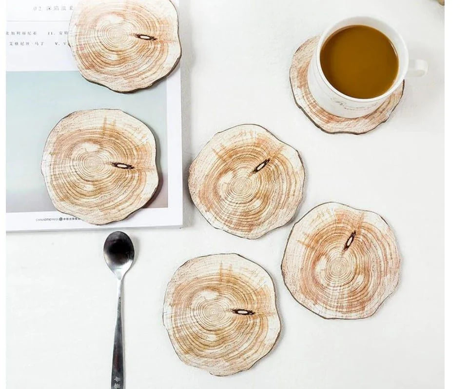 Set of 6 premium wooden coasters in oak and walnut finishes, designed to protect surfaces from water damage and enhance the ambiance of any space.