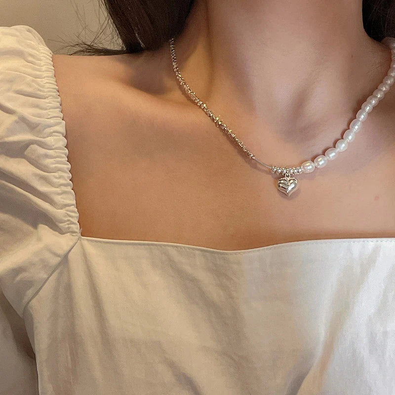 Elegant heart-shaped pearl necklace in sterling silver, a timeless British-inspired accessory
