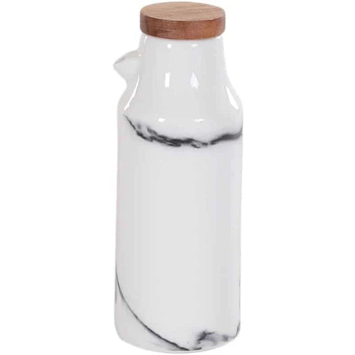 Ceramic salt and pepper shaker set with oil bottle in light grey porcelain finish, featuring minimalist design and easy-grip handles
