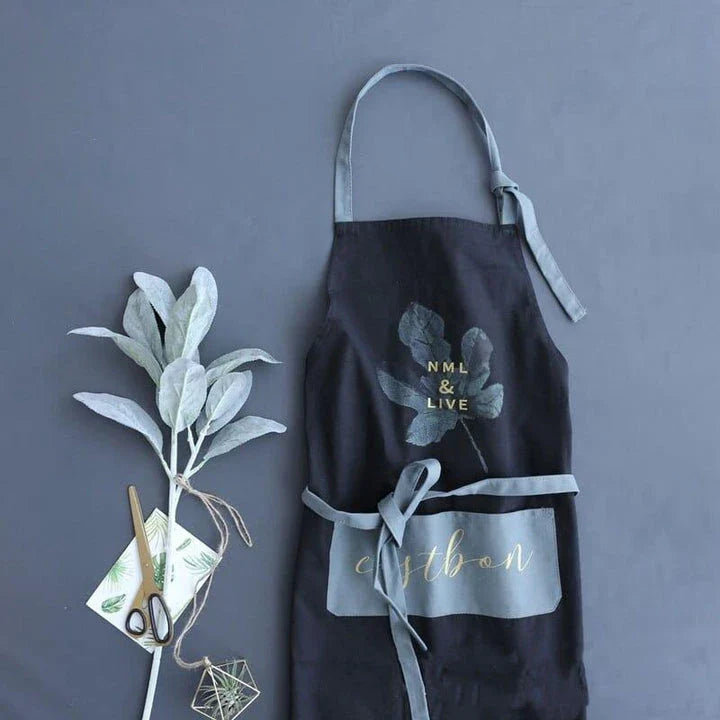 Premium cotton barista apron with a beautiful coconut leaf print design, perfect for coffee shop staff