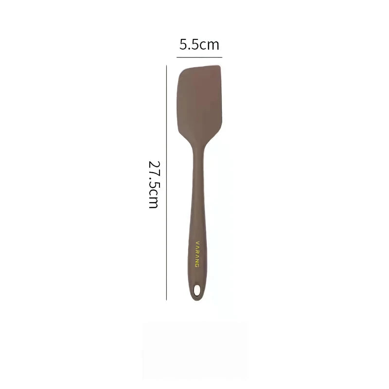 A set of two high-quality silicone spatulas in brown and yellow colours, designed for versatile cooking and baking tasks.